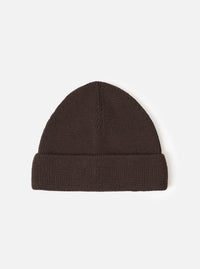 A Brown Merino Knit Watch Cap displayed flat against a plain studio background. The classic knitted beanie features a soft ribbed texture, a turn-up cuff, and a comfortable stretchy fit in rich brown merino wool.