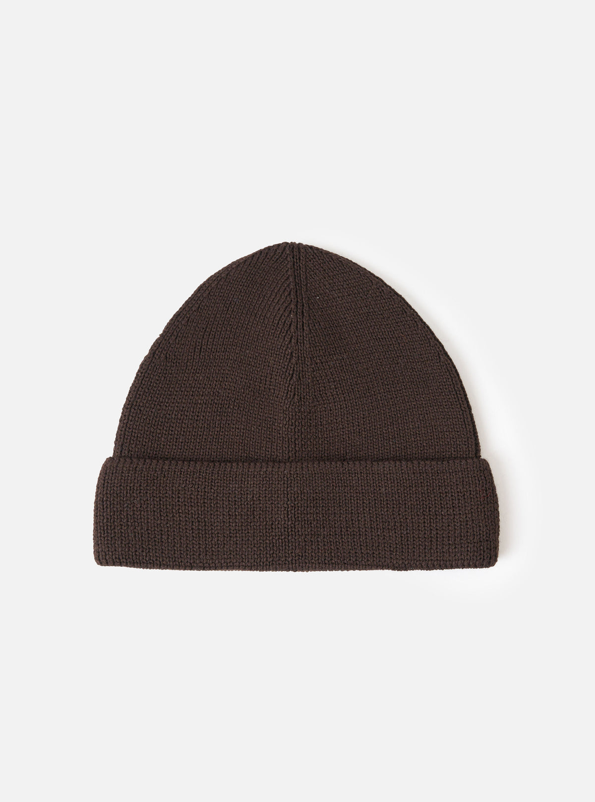 A Brown Merino Knit Watch Cap displayed flat against a plain studio background. The classic knitted beanie features a soft ribbed texture, a turn-up cuff, and a comfortable stretchy fit in rich brown merino wool.