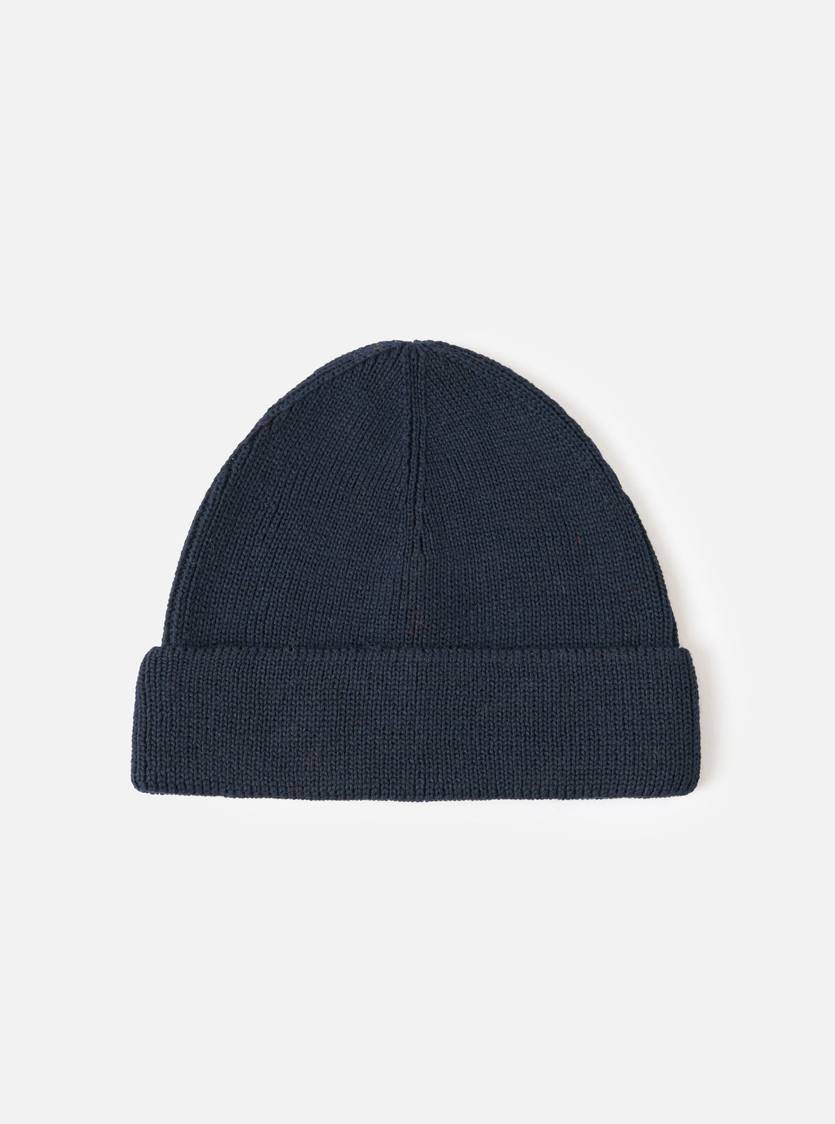 A full view of the Navy Merino Knit Watch Cap displayed against a clean white studio background. The deep navy blue knitted beanie features a thick folded cuff and a classic ribbed pattern throughout.