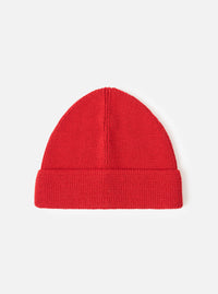 A front-facing view of the Red Merino Knit Watch Cap presented on a plain white studio background. The vibrant red knitted watch cap features a prominent turn-up cuff and uniform ribbed construction.