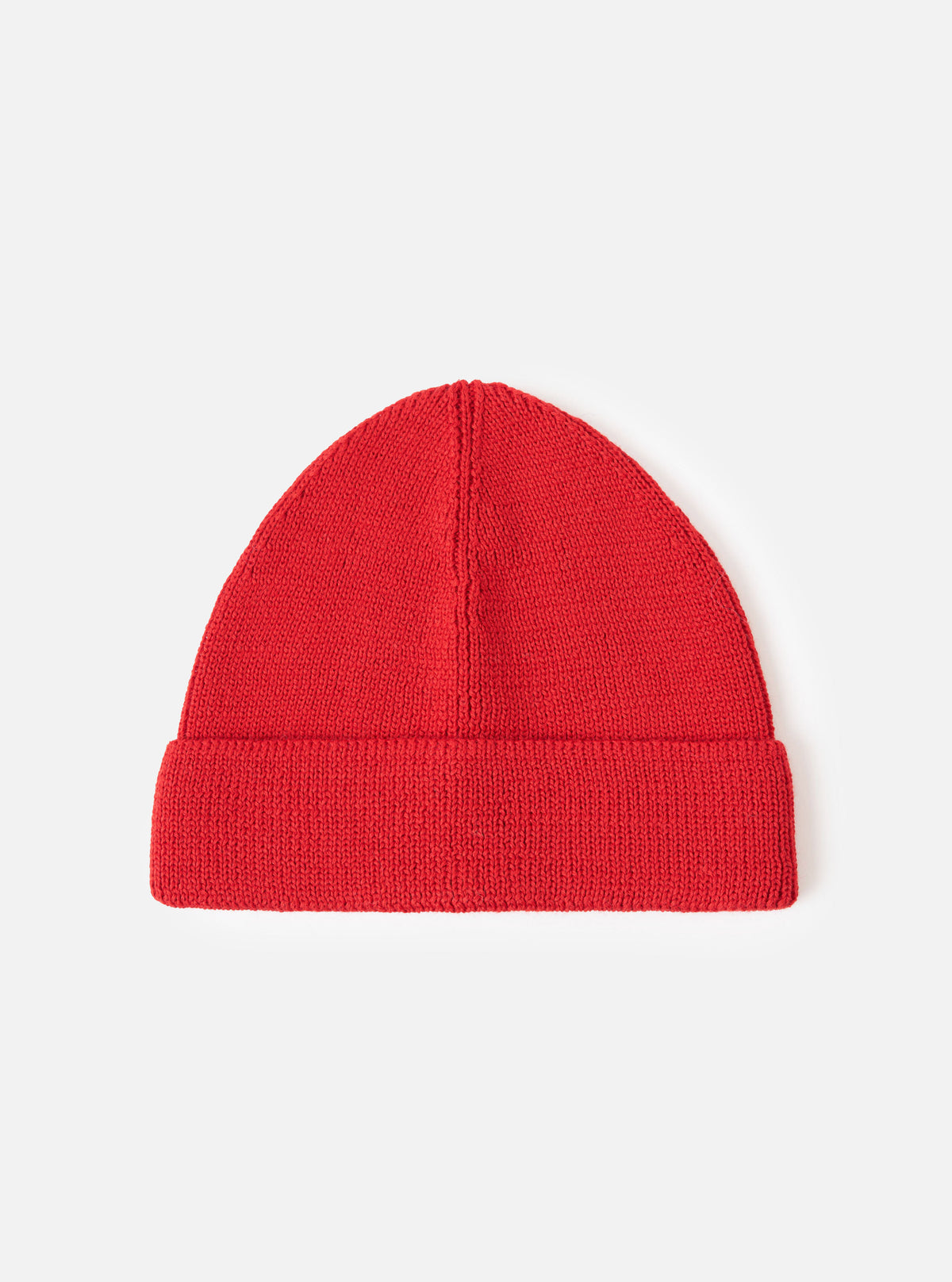 A front-facing view of the Red Merino Knit Watch Cap presented on a plain white studio background. The vibrant red knitted watch cap features a prominent turn-up cuff and uniform ribbed construction.