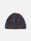 A full front view of the Navy Alpaca Argyle Argyll Hat set against a plain white background. The soft alpaca blend knit cap features a classic argyle pattern in dark navy blue with contrasting geometric details and a folded cuff.