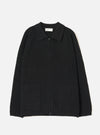 A full front view of the Black Eco Wool Zip Cardigan displayed on a crisp white studio background. The dark grey and black wool knitted cardigan features a full two-way front zip fastening, funnel neck collar, and ribbed hem.