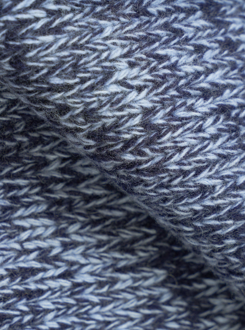 A close-up fabric swatch image of the Sky/Navy Lambswool Zip Cardigan. The texture shot focuses on the intricate weave of the soft sky blue and navy marled lambswool yarn, displayed on a clean white background.