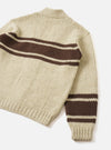 Back view of the Ecru Chunky Knit Stripe Langdale Cardigan set against a plain white studio background. Showcases the relaxed fit silhouette, ribbed hem, cuffs, and continuous intarsia striped pattern across the ecru chunky wool knit.
