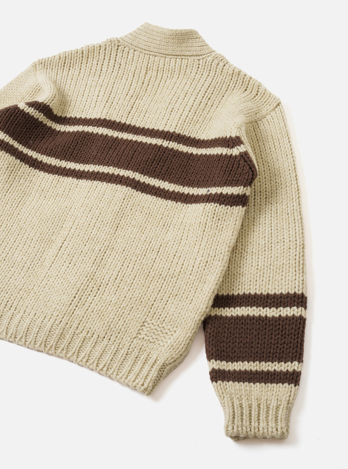 Back view of the Ecru Chunky Knit Stripe Langdale Cardigan set against a plain white studio background. Showcases the relaxed fit silhouette, ribbed hem, cuffs, and continuous intarsia striped pattern across the ecru chunky wool knit.
