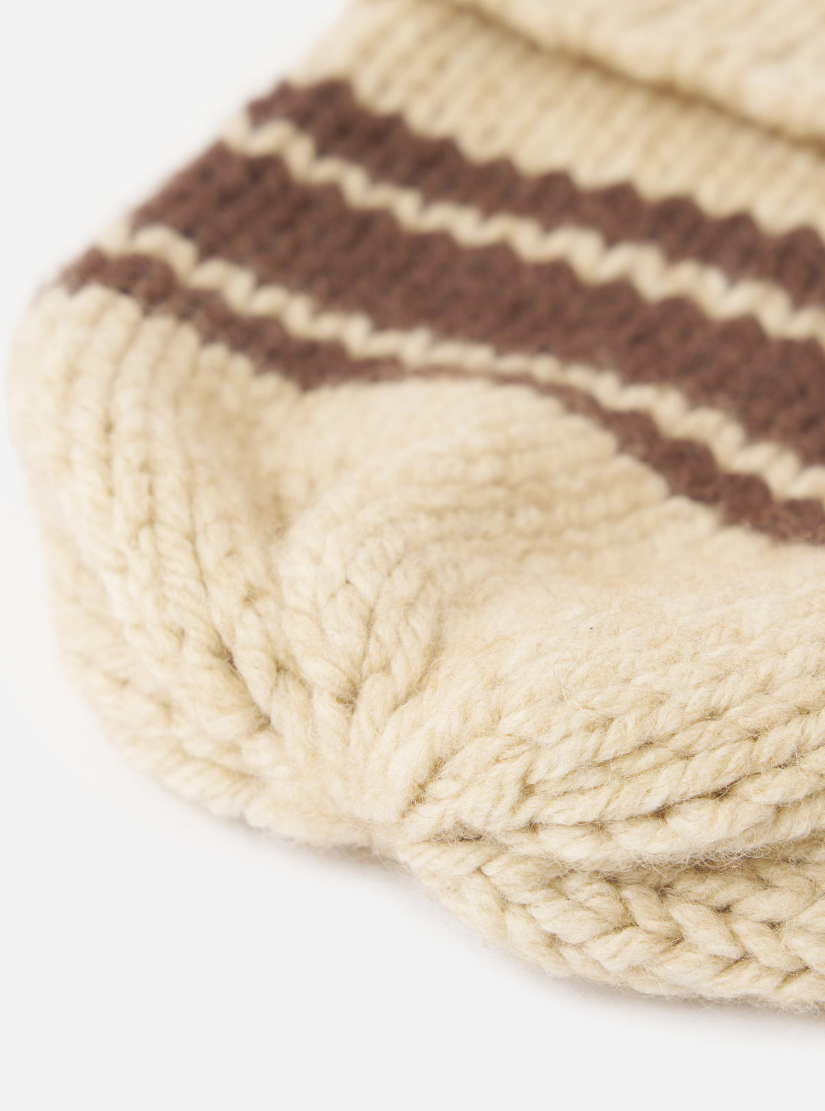 A close-up detail shot of the Ecru Chunky Knit Stripe Lenny Hat against a plain white studio background, showcasing the soft texture of the chunky wool knit and the defined contrast stripe design.