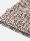 An angled view of the Ecru/Brown Lambswool Watch Cap displayed on a seamless white background. The shot highlights the rich lambswool texture, folded brim, and speckled brown and ecru colorway.