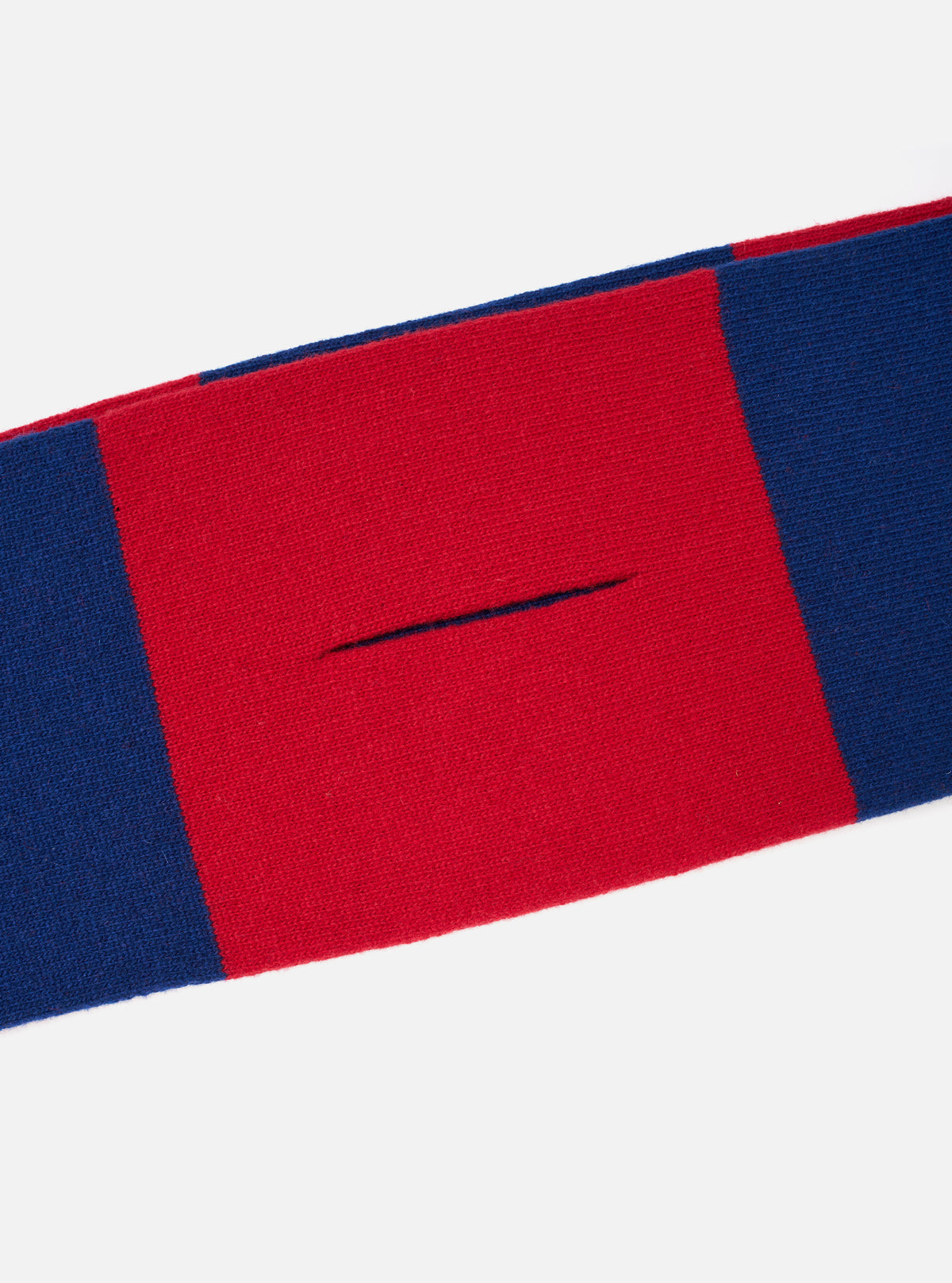 A detailed close-up shot of the Blue/Red Soft Wool Deluxe Football Scarf on a plain white studio background, focusing on the knitted soft wool texture, neat edge finish, and vibrant color block design.