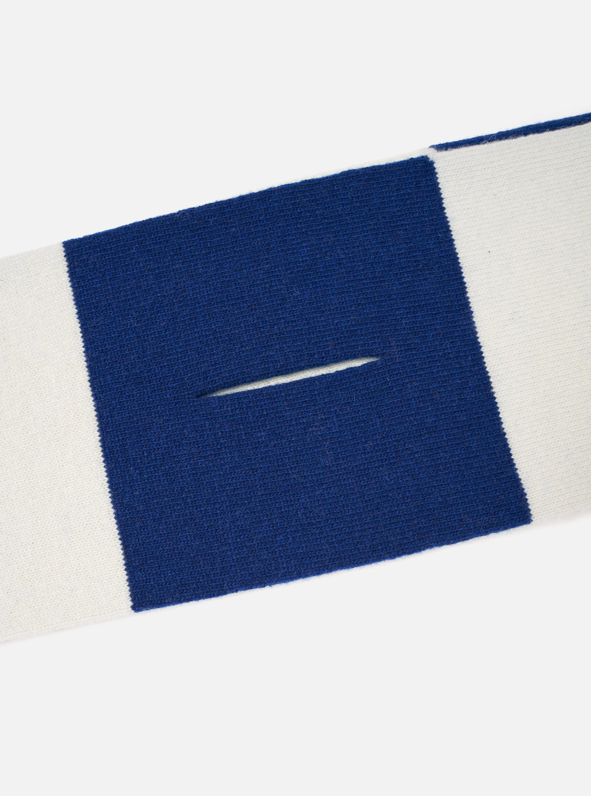 A close-up detail shot of the Ecru/Blue Soft Wool Deluxe Football Scarf against a white studio background, highlighting the delicate soft wool weave, clean edges, and subtle fringe details.