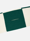 A close-up detail image of the Ecru/Green Soft Wool Deluxe Football Scarf against a plain white background, focusing on the fine knitted weave, finished fringe trim, and soft wool fabric quality.