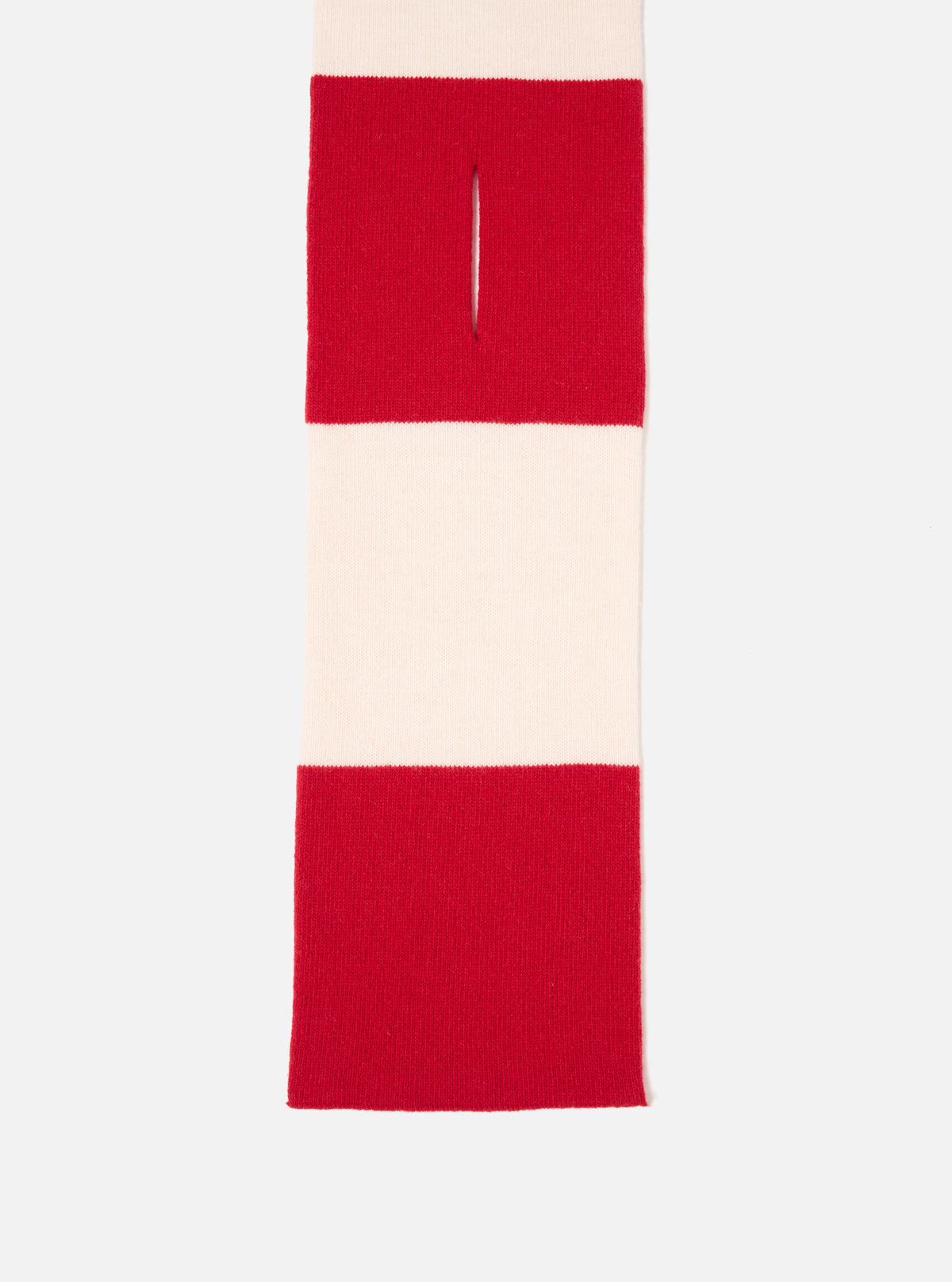 An angled view of the Ecru/Red Soft Wool Deluxe Football Scarf laid out on a clean white studio background. The image highlights the soft wool weave, vibrant red accent panels, and fine fringed ends of the scarf.