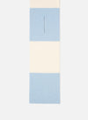 An angled layout shot of the Ecru/Sky Soft Wool Deluxe Football Scarf on a plain white background. The image highlights the soft texture of the wool blend fabric along with the pale sky blue and ecru contrast blocks.