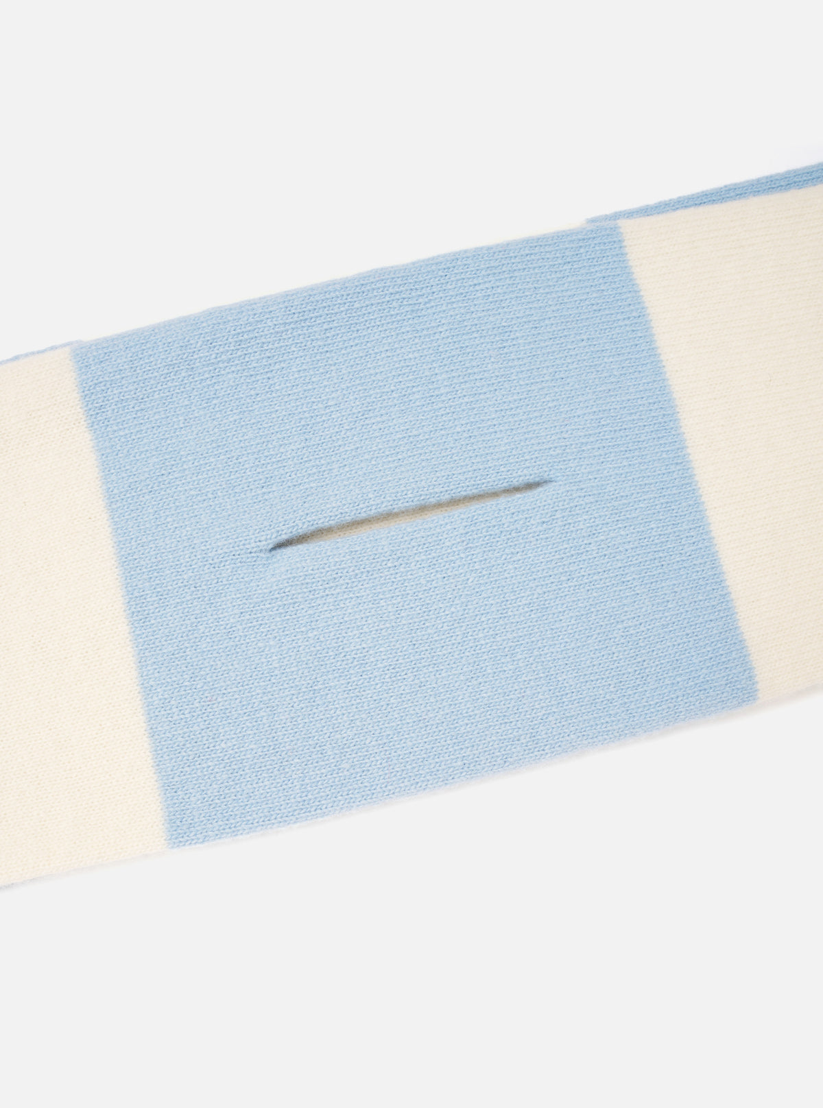 A close-up detail shot of the Ecru/Sky Soft Wool Deluxe Football Scarf against a white background. The focus is on the fine knitted weave of the soft wool material, contrasting color bands, and fringe detailing along the border.