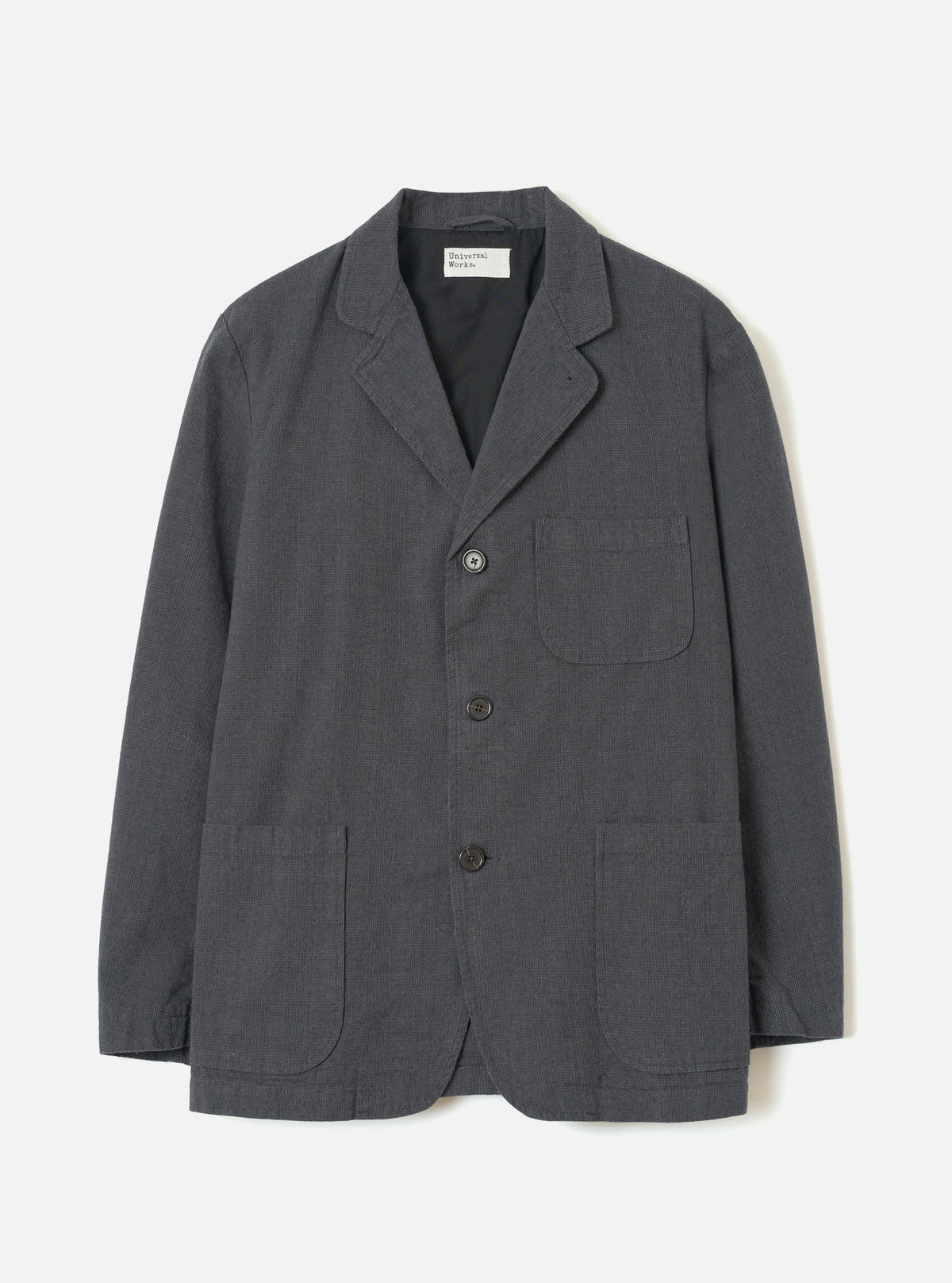 A full front product view of the Grey Liverpool Check Three Button Jacket on a plain white background. The jacket features a classic three-button front closure, notched lapels, flap pockets, and a subtle grey checked cotton-linen fabric.