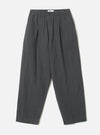 A front view of the Grey Liverpool Check Oxford Pant laid out flat against a plain white background. The loose-fit trousers feature a drawstring waistband, front pleats, side pockets, and a subtle grey cotton-linen check weave.