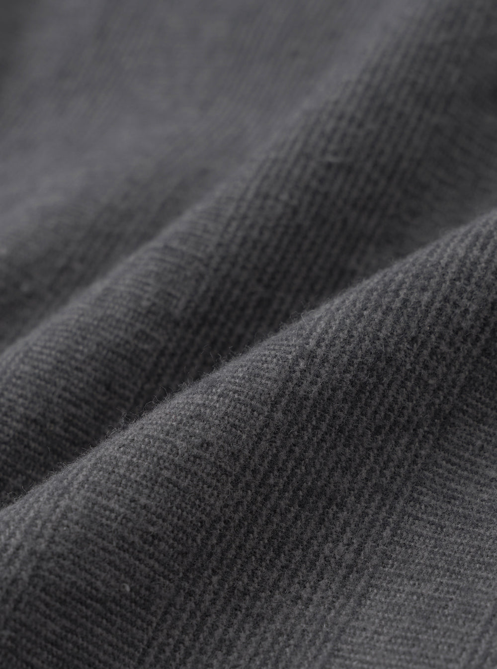 A close-up swatch image showcasing the fabric pattern of the Grey Liverpool Check Oxford Pant on a white background. The shot details the crisscross grey checked weave and natural texture of the cotton and linen blend material.