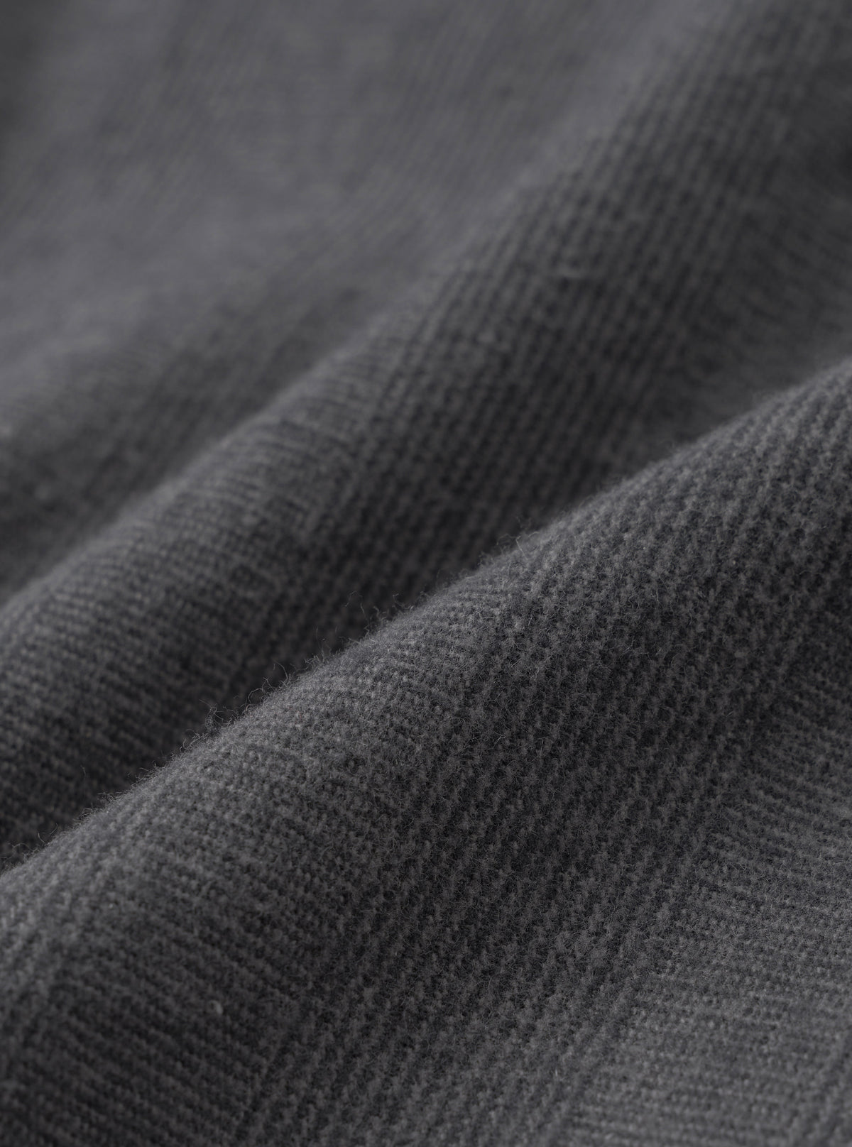 A close-up swatch image showcasing the fabric pattern of the Grey Liverpool Check Oxford Pant on a white background. The shot details the crisscross grey checked weave and natural texture of the cotton and linen blend material.