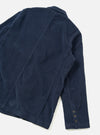 A back view of the Dark Navy Cord Manor Jacket against a clean, plain white background. The image showcases the fine corduroy texture, straight hemline, structured rear shoulders, and navy cotton stitching.