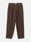 A full front view of the Cacao Cord Pleated Track Pant displayed flat on a plain white studio background. The cacao brown trousers feature a drawstring waist, pleated front detailing, and tapered leg cut.