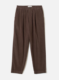 A full front view of the Cacao Cord Pleated Track Pant displayed flat on a plain white studio background. The cacao brown trousers feature a drawstring waist, pleated front detailing, and tapered leg cut.