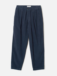 A front product shot of the Dark Navy Cord Pleated Track Pant against a plain white background. The dark blue trousers show the relaxed fit, front pleats, drawstring elastic waistband, and tapered trouser legs.