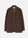 A front view of the Cacao Cord Three Button Jacket presented flat against a plain white background. The dark brown jacket features a three-button front closure, lapels, patch pockets, and fine corduroy fabric.