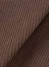 Extreme close-up fabric swatch of the Cacao Cord Three Button Jacket, fill-frame shot against a plain background. The detail showcases the ribbed wale texture, soft velvet finish, and deep brown hue of the pure cotton corduroy.