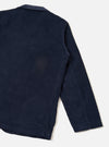 Rear view of the Dark Navy Cord Three Button Jacket worn by a model against a plain off-white background. The image highlights the clean back seams, relaxed fit, and deep navy blue corduroy texture of the unstructured jacket.