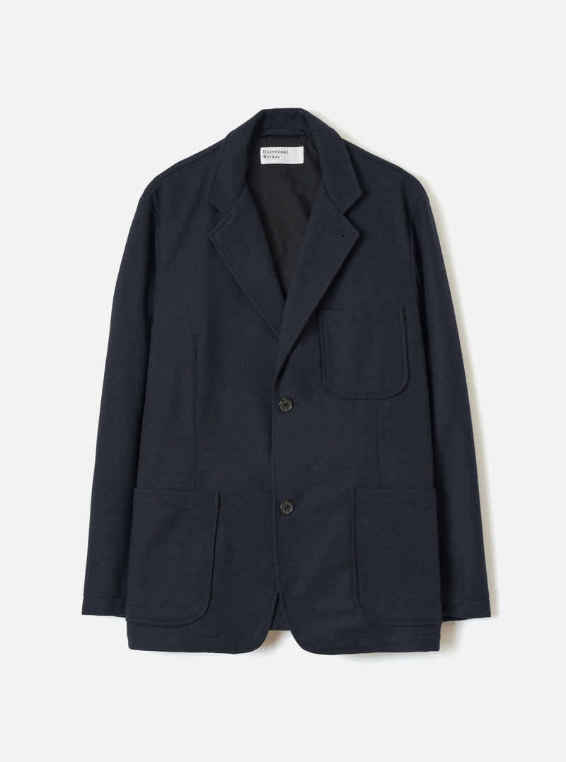Front view of the Dark Navy Dublin Wool Mix Two Button Jacket worn by a model on a plain background. The jacket features a two-button front fastening, wider notched lapels, two lower patch pockets, and a single chest pocket.