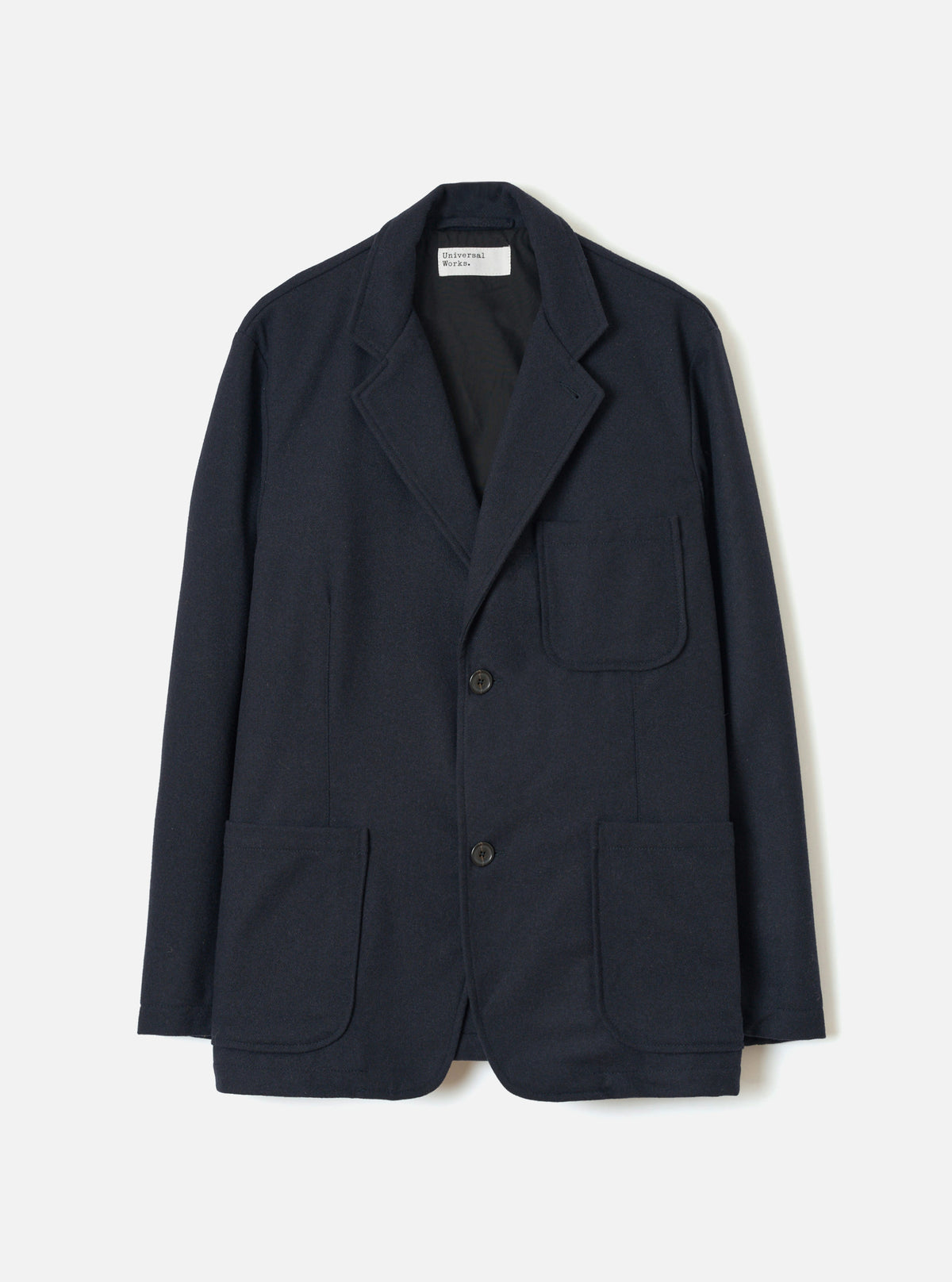 Front view of the Dark Navy Dublin Wool Mix Two Button Jacket worn by a model on a plain background. The jacket features a two-button front fastening, wider notched lapels, two lower patch pockets, and a single chest pocket.