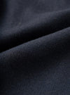 Full-frame close-up swatch showing the fabric detail of the Dark Navy Dublin Wool Mix Two Button Jacket. The image highlights the fine woven texture, dark navy heathered weave, and premium wool-blend suiting material.