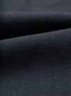 Close-up swatch view displaying the fabric weave of the Dark Navy Dublin Wool Mix Oxford Pant. The shot fills the frame, showcasing the fine dark navy heathered texture and soft wool-blend weave of the trousers.