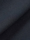 A close-up fabric swatch view showing the intricate weave and soft texture of the Dark Navy Dublin Wool Mix Rose Bowl Jacket. The image fills the frame to emphasize the rich navy color and material quality.