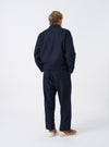 A male model wears the Dark Navy Dublin Wool Mix Rose Bowl Jacket unbuttoned, captured in a three-quarter pose against a plain white studio background. The shot details the front pockets and relaxed fit.