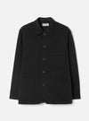 Front view of the Black Dexter Twill OG Bakers Chore Jacket displayed against a plain off-white background. The shot highlights the classic collar, contrast front buttons, and multiple functional patch pockets.