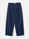 Front view of the Indigo Future Denim Grad Chino displayed against a clean off-white background. The image shows the fixed waistband with belt loops, zip fly, front pockets, and loose tapered legs.