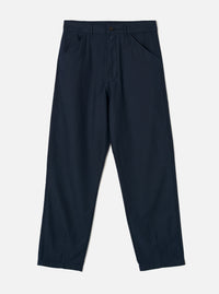 Front view of the Navy Slub Sateen Utility Pant set against a plain off-white background. The shot highlights the diagonal front frogmouth pockets, zip fly, belt loops, and relaxed tapered leg cut.