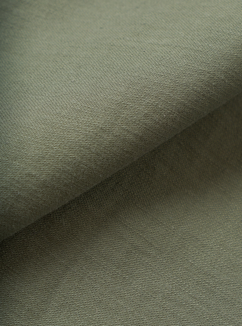 A close-up fabric swatch image showcasing the rich olive green tone and distinct slub sateen texture of the cotton fabric. The material fills the entire frame to highlight the intricate weave details.
