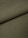 A close-up fabric swatch showing the rich olive green slub sateen cotton material. The shot fills the frame to emphasize the distinct woven texture, natural slub variation, and fabric surface details.