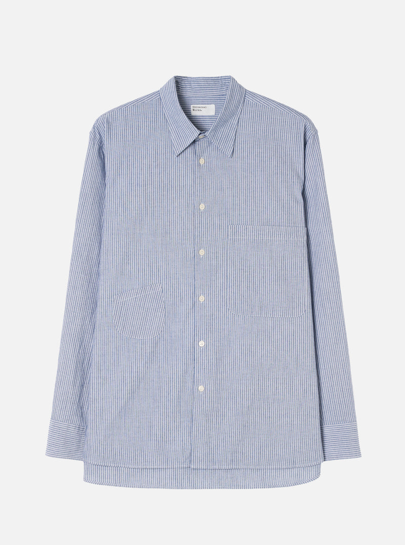 Front view of the Blue Montgomery Stripe Station Shirt displayed against a plain off-white background. The shot highlights the vertical blue stripe pattern, classic point collar, full front button placket, and dual chest patch pockets.
