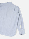 Rear view of the Blue Montgomery Stripe Station Shirt displayed on a clean neutral background. The photograph showcases the vertical blue striped cotton fabric, straight hemline, neat shoulder yoke, and back pleat construction of the garment.