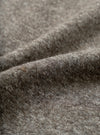 A close-up fabric swatch view showing the intricate marl weave of the Mid Brown Dam Marl Work Shirt. The frame is filled with the warm brown heathered texture and soft brushed wool-blend fleece.
