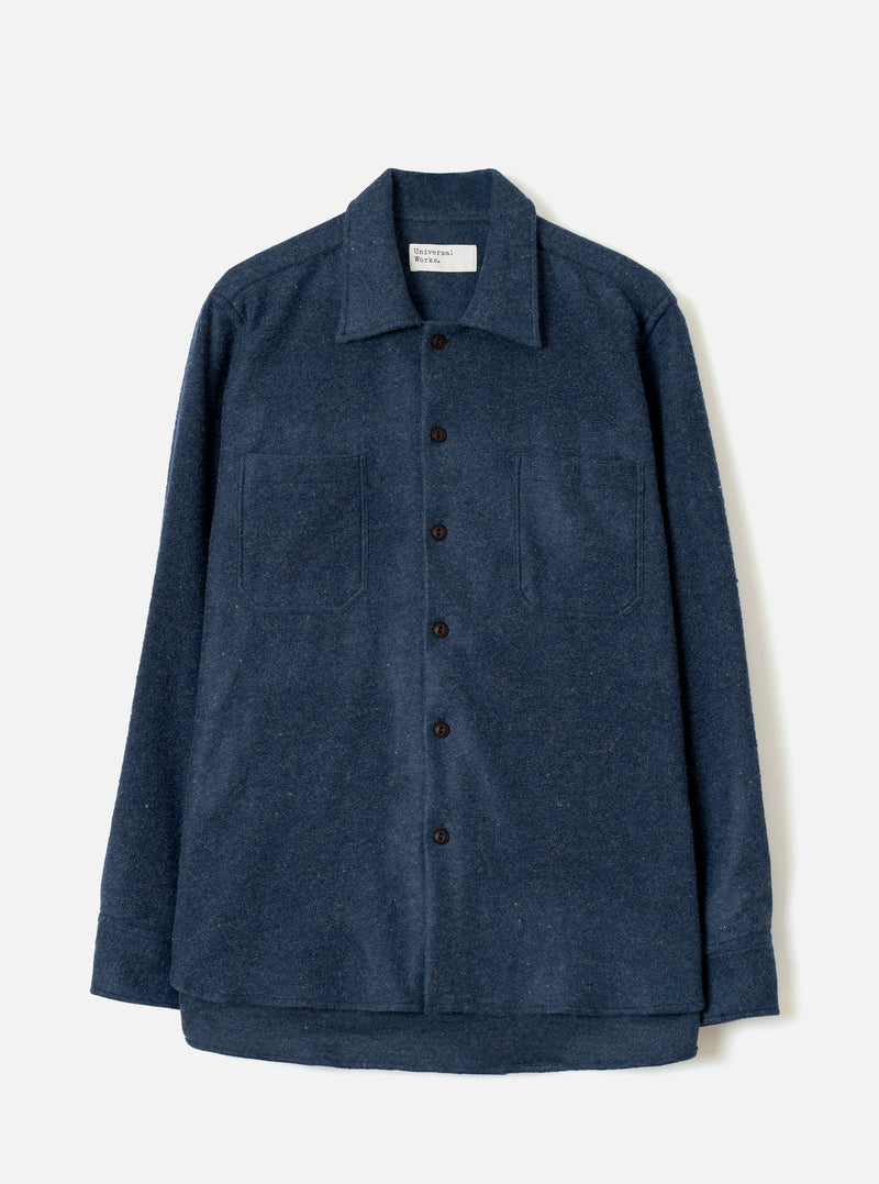 Front view of the Navy Dam Marl Work Shirt presented against a clean off-white background. The shot highlights the classic open collar, two functional chest pockets, and navy blue button-front placket.