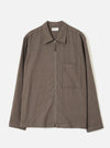 Front view of the Brown Monty Cotton Tencel Zip Shirt displayed against a plain white background. The studio shot emphasizes the full zip front, flat collar, chest pocket, and smooth brown fabric.