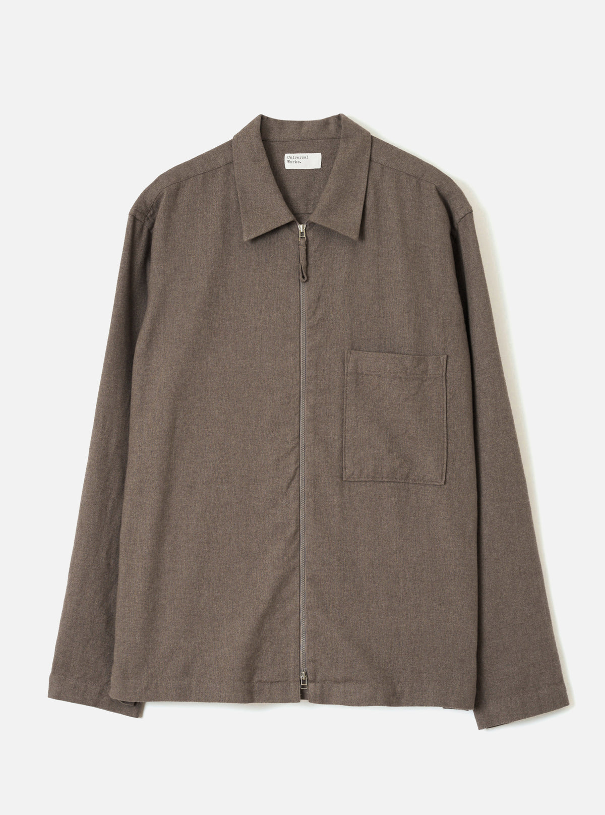 Front view of the Brown Monty Cotton Tencel Zip Shirt displayed against a plain white background. The studio shot emphasizes the full zip front, flat collar, chest pocket, and smooth brown fabric.