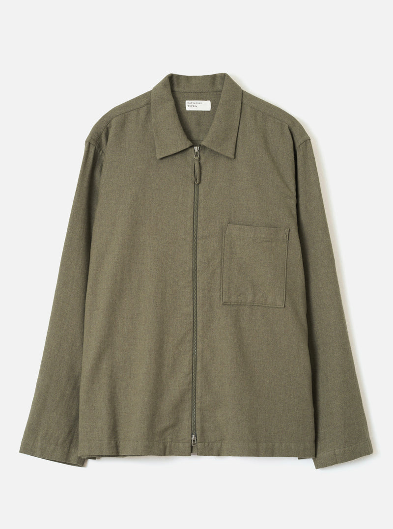 Front view of the Olive Monty Cotton Tencel Zip Shirt displayed flat against a plain off-white background, featuring the classic collar, zip front closure, chest pocket, and relaxed fit.