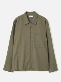 Front view of the Olive Monty Cotton Tencel Zip Shirt displayed flat against a plain off-white background, featuring the classic collar, zip front closure, chest pocket, and relaxed fit.