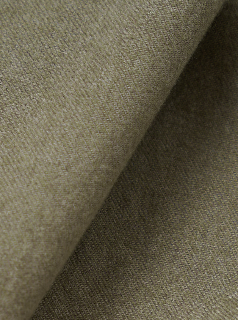 A detailed fabric swatch image filling the frame to highlight the fine weave, soft texture, and deep olive green tone of the material used for the Olive Monty Cotton Tencel Zip Shirt.