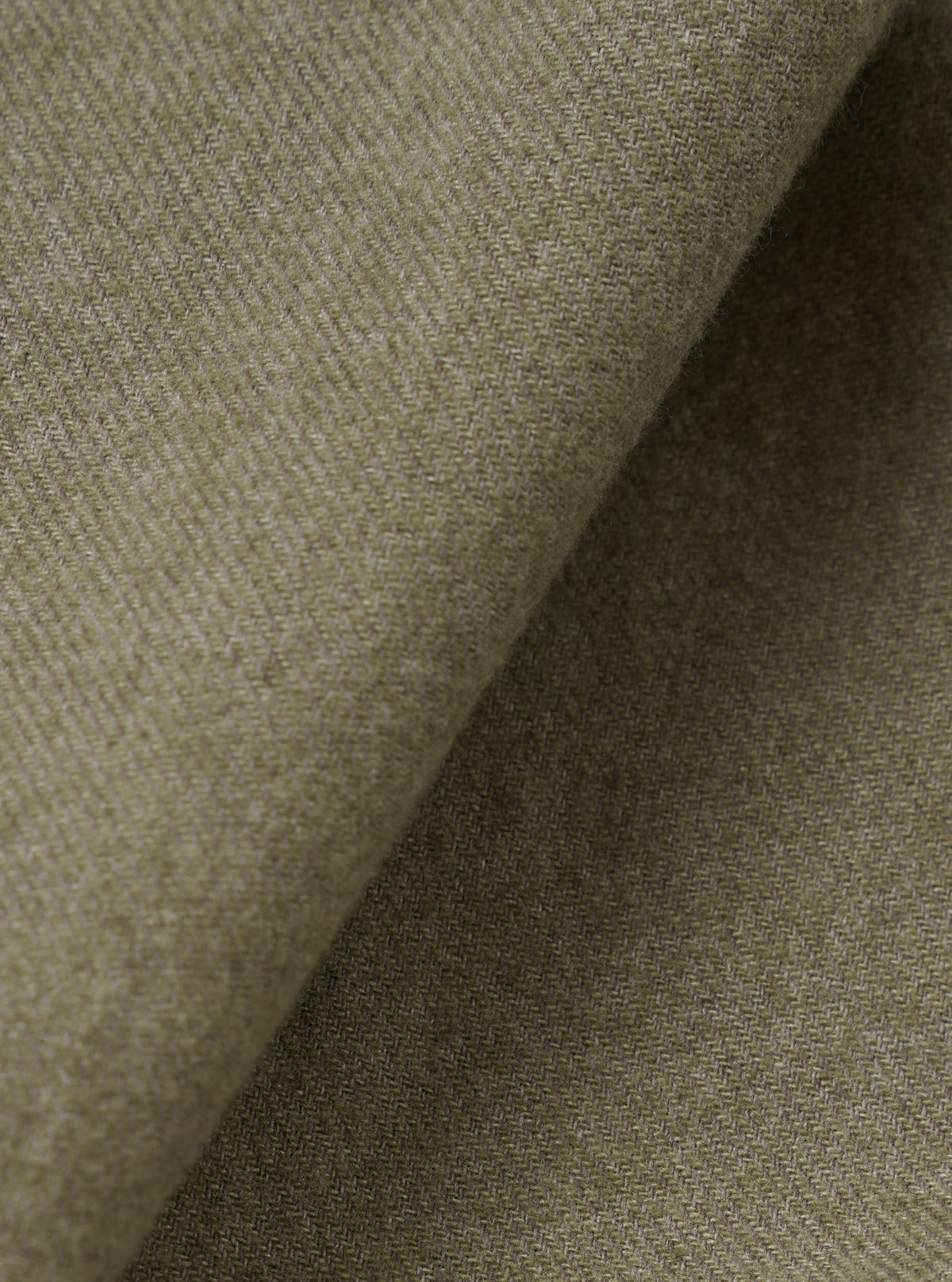 A detailed fabric swatch image filling the frame to highlight the fine weave, soft texture, and deep olive green tone of the material used for the Olive Monty Cotton Tencel Zip Shirt.